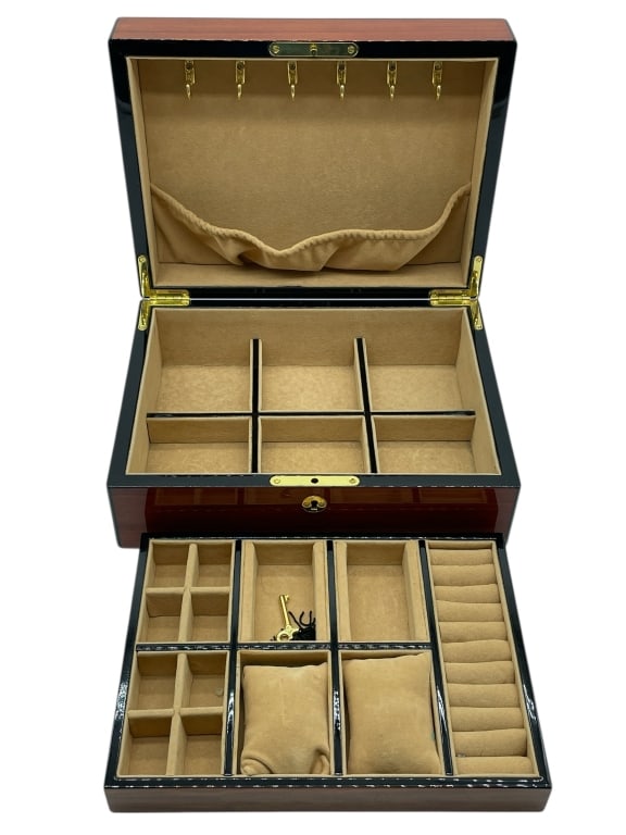 VOX LUXURY WATCH AND JEWELRY BOX 12": VOX LUXURY WATCH AND JEWELRY BOX 12" -Very good pre owned condition -Approx 5"h x 12"w x 9"d -This is a stunning, high-quality jewelry box, featuring a rich dark wood with a deep, glossy lacquer finis