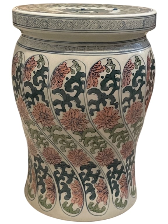 CHINESE PORCELAIN CHRYSANTHENUM GARDEN SEAT 16": Chinese porcelain garden seat measuring approximately 16" x 11". The barrel-shaped seat features an elegant design of scrolling green foliage and blooming pink chrysanthemum flowers arranged in flowin