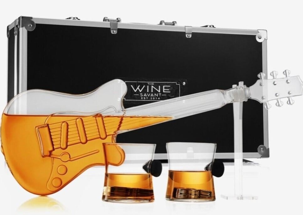 NEW IN CASE! WINE SAVANT ELECTRIC GUITAR DECANTER: New in Case! Wine Savant Electric Guitar Decanter Unleash your inner rockstar with the Electric Guitar Decanter, a remarkable piece of drinkware that combines artistry, music, and fine spirits. Crafte