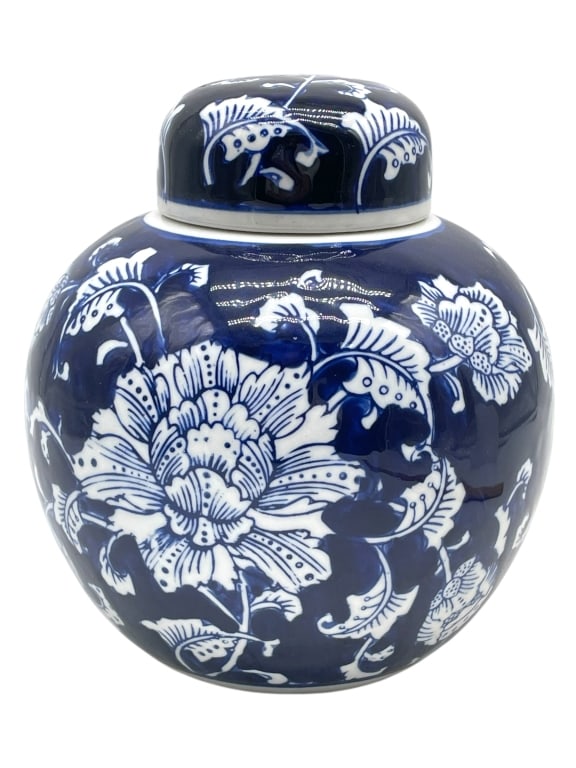 BLUE AND WHITE PORCELAIN COVERED GINGER JAR 8": BLUE AND WHITE PORCELAIN COVERED GINGER JAR WITH FLORAL DESIGN -Very good pre owned condition -Approx 8"h x 6.5"w -A classic blue and white porcelain covered ginger jar featuring bold hand-painted flo