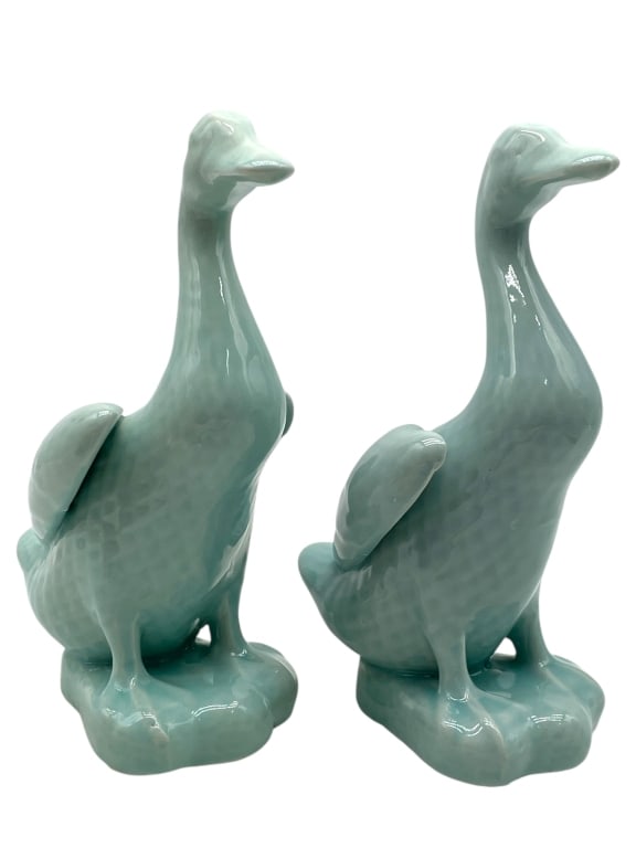 PAIR OF PORCELAIN GLAZED DUCK FIGURINES 9": PAIR OF PORCELAIN GLAZED DUCK FIGURINES 9" -Very good pre owned condition -Approx 5"l x 4"w x 9"h -Glazed porcelain duck figures, each modeled in a stylized form with incised feather details and finis