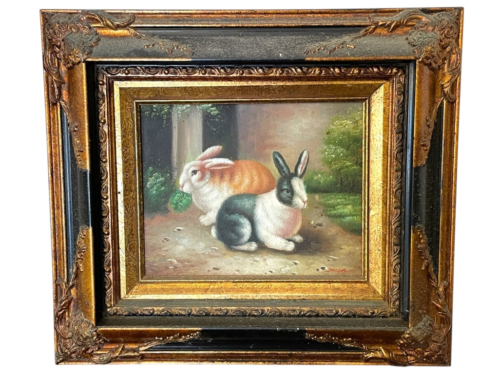 FRAMED PAINTING OF TWO RABBITS 17": FRAMED PAINTING OF TWO RABBITS 17" -Very good pre owned condition -Approx 17"l x 2"w x 15"h -Painting depicting two rabbits in a pastoral setting, one in soft orange and white tones and the other in b