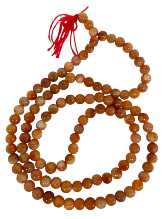 60" STRAND OF SNAKESKIN AGATE BEADS: 60" STRAND OF SNAKESKIN AGATE BEADS -Very good pre owned condition -Individual beads approx .5" dia. -The stones exhibit natural translucency and variation, adding depth and texture. Ideal for jewelry