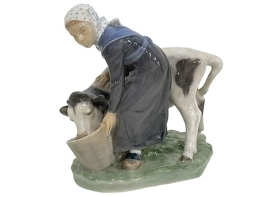 ROYAL COPENHAGEN FIGURINE OF GIRL FEEDING A CALF