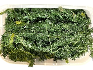 BIN OF HOLIDAY GREENERY WITH INTERTWINED LIGHTS