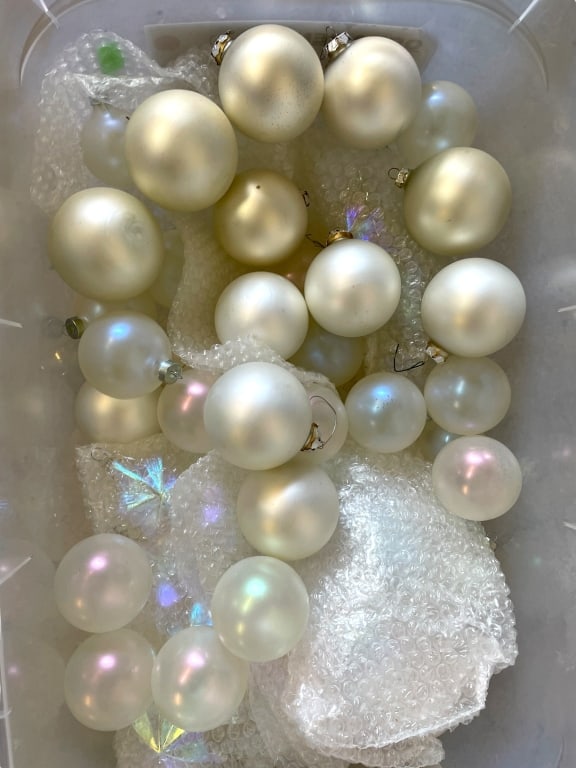 BIN OF IRIDESCENT & PEARL CHRISTMAS ORNAMENTS: BIN OF CHRISTMAS ORNAMENTS IN IRIDESCENT WHITE AND PEARL TONES -VARYING CONDITIONS, SOME BROKEN, SEE PHOTOS -THIS COLLECTION FEATURES A MIX OF MATTE AND SHINY FINISHES WITH SUBTLE SHIMMERS THAT REFLEC