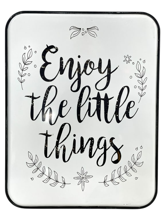 METAL WALL SIGN "ENJOY THE LITTLE THINGS": METAL WALL SIGN "ENJOY THE LITTLE THINGS" -SHOWROOM CONDITION -APPROX 27" X 20" -METAL WALL SIGN WITH INSPIRATIONAL PHRASE "ENJOY THE LITTLE THINGS" IN BLACK SCRIPT LETTERING, SURROUNDED BY WHIMSICAL 