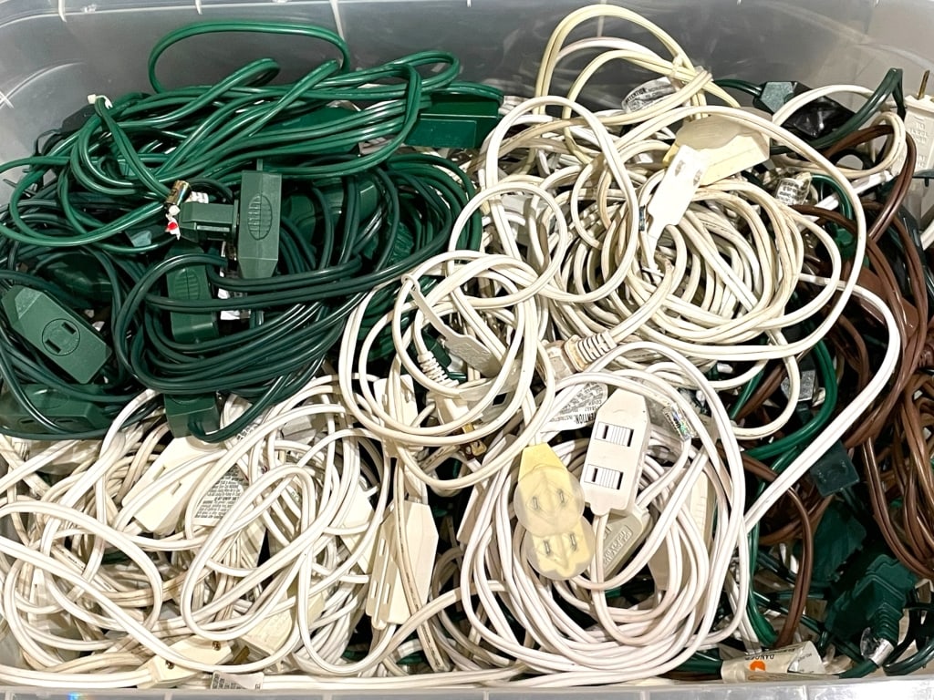 BIN OF HOLIDAY EXTENSION CORDS & OUTLET SPLITTERS (1 of 3)
