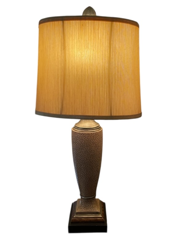TALL DECORATIVE TABLE LAMP WITH TEXTURED BASE: TALL DECORATIVE TABLE LAMP WITH TEXTURED BASE AND SHADEA tall decorative table lamp with a textured tapered body in a neutral taupe finish accented by dark stippling, set on a square stepped base with