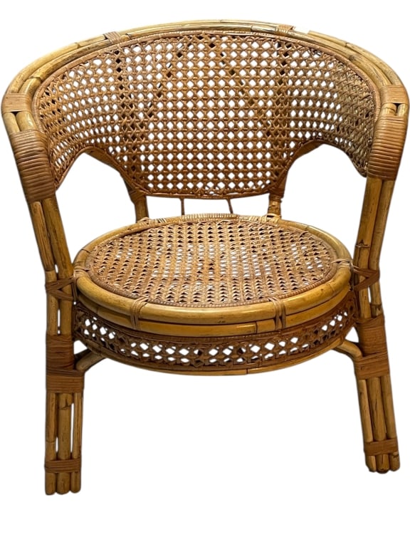 VINTAGE WOVEN RATTAN BARREL ACCENT CHAIR: VINTAGE WOVEN RATTAN BARREL ACCENT CHAIR IN NATURAL FINISH -A charming vintage barrel-back accent chair constructed entirely from natural rattan and wicker in a light honey tone, typical of mid-centur