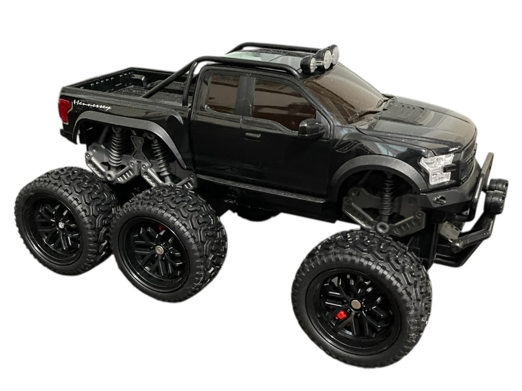 HENNESSEY 6X6 BLACK PICKUP TRUCK MODEL 14": HENNESSEY 6X6 BLACK PICKUP TRUCK MODEL 14"_x005F -Very good pre owned condition_x005F -Approx 8"h x 6"w x 14"d_x005F -Hennessey 6x6 black pickup truck model featuring six oversized off-road tires, rai
