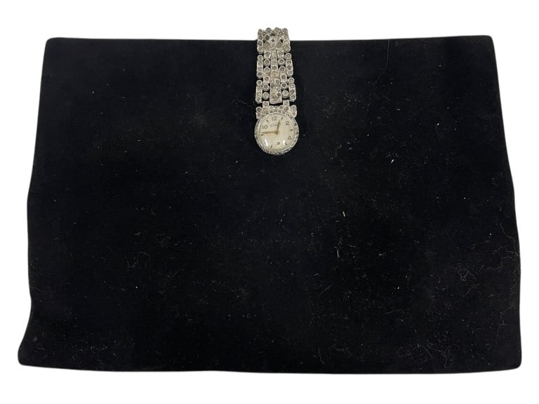 KORET VELVET EVENING CLUTCH W WRISTWATCH CLASP: KORET BLACK VELVET EVENING CLUTCH W WRISTWATCH CLASP_x005F -Good pre owned condition, missing some rhinestones, watch untested_x005F -Approx 8.5"l x 6"h_x005F -Elegant vintage black velvet evening clu