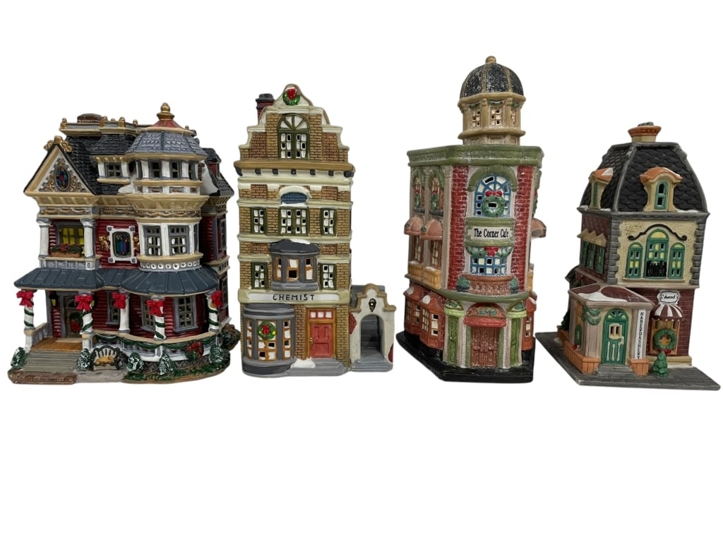 4 HOLIDAY CHRISTMAS VILLAGE BUILDINGS INCL DEPT 56: A LOT OF FOUR LIGHTED VILLAGE BUILDINGS IS PRESENTED. THE LOT INCLUDES "HABERDASHERY" (1992) FROM THE DEPARTMENT 56 CHRISTMAS IN THE CITY SERIES, A BUILDING FROM "DICKENS COLLECTABLES" (1995), A LIMIT
