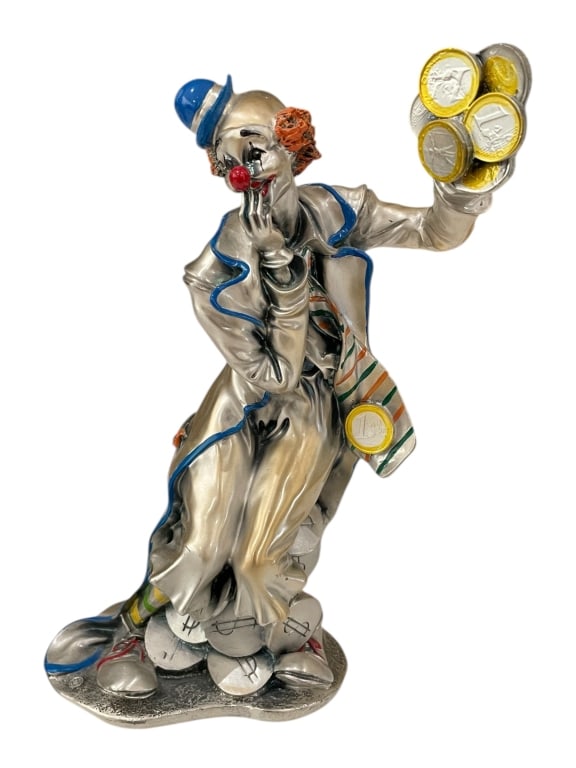 LEONARDO SILVER CLOWN SCULPTURE W BLUE HAT 11": LEONARDO SILVER CLOWN SCULPTURE W BLUE HAT 11"_x005F -Very good pre owned condition_x005F -Approx 11"h x 9"w_x005F -Charming clown figurine crafted in metallic tones with vibrant enamel accents. The p