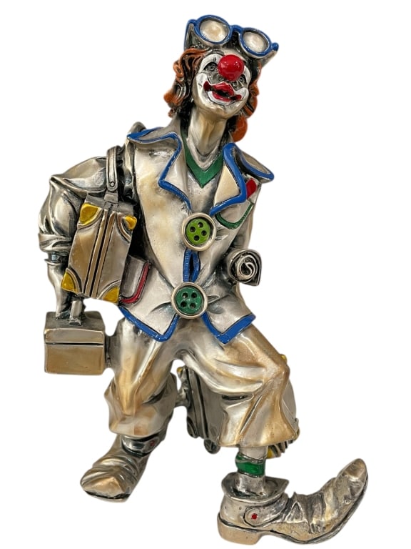 LEONARDO SILVER CLOWN SCULPTURE W LUGGAGE 11": LEONARDO SILVER CLOWN SCULPTURE W LUGGAGE 11"_x005F -Very good pre owned condition_x005F -Approx 11"h x 7"w_x005F -Whimsical metallic clown figurine featuring vibrant enamel accents in blue, green, ye