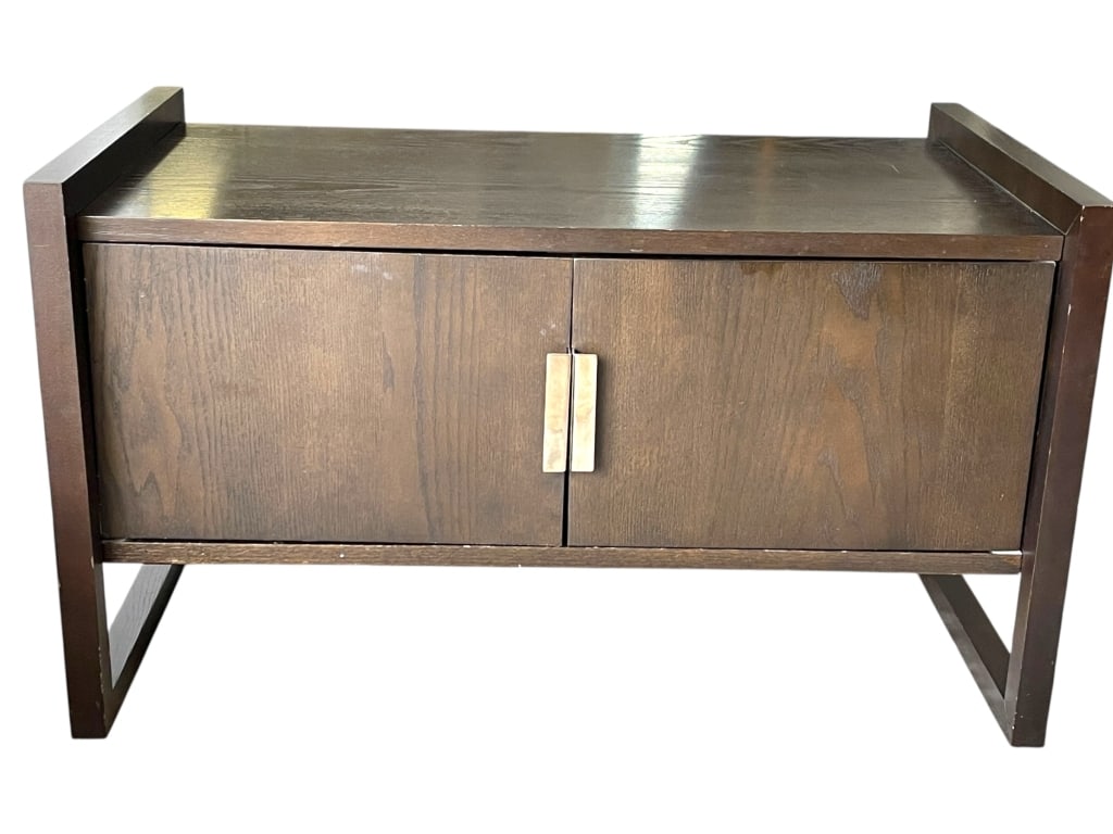 MID-CENTURY STYLE WOOD CABINET 41": MID-CENTURY STYLE WOOD CABINET – COMPACT TWO-DOOR CABINET IN A WARM WALNUT FINISH WITH CLEAN LINES, RECTANGULAR LEGS, AND A SLIGHTLY RAISED FRAME DESIGN. FEATURES SIMPLE BRUSHED METAL HARDWARE AND A