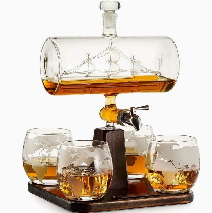 NEW IN BOX. ANTIQUE SHIP DECANTER: IMPRESS WITH QUALITY: This Handmade decanter will make anyone admire the artfully detailed antique ship, beautifully set in the Cylinder Ship decanter. Trust the Brand of quality and luxury The Wine S