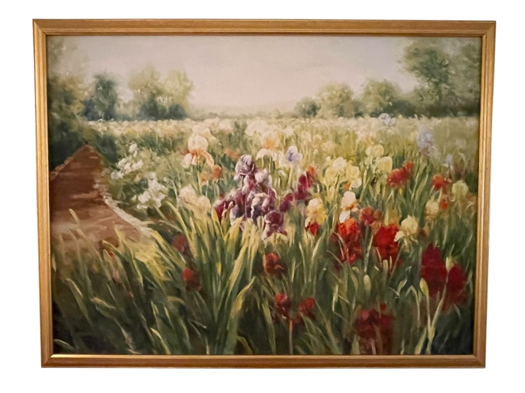 FRAMED OIL PAINTING OF VIBRANT IRISES 51": Beautiful framed oil painting depicting a vibrant field of blooming irises in shades of red, yellow, lavender, and white. A soft impressionist style brings warmth and movement to the piece, with a gar