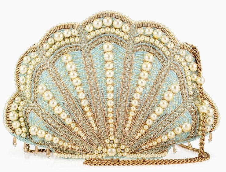 NEW MARY FRANCES SEASIDE LUXURY SHELL HANDBAG: Seaside Luxury Handbag captures the elegance of ocean treasures with its shimmering shell design and pearl accents. The soft blue tones and golden details evoke the beauty of a seaside escape. Perfect