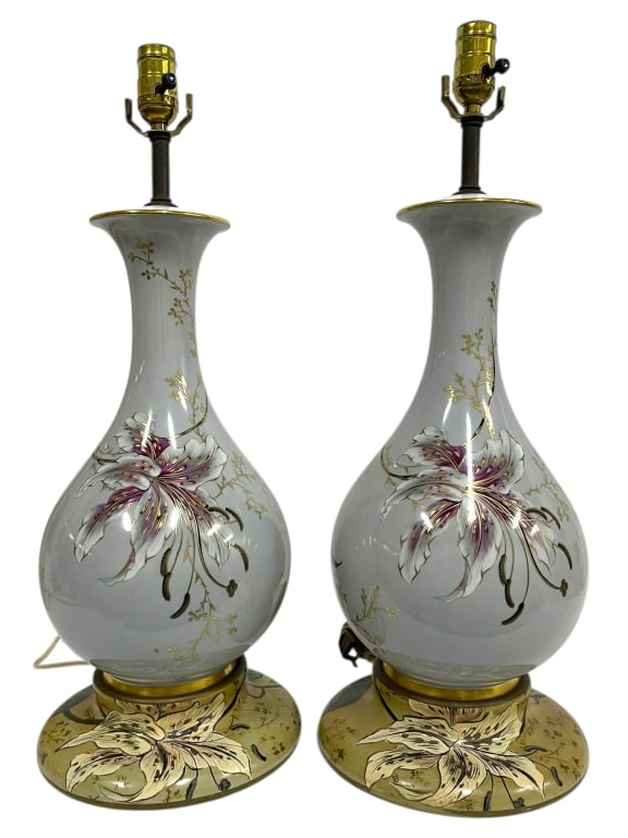 PAIR OF PORCELAIN TABLE LAMPS W FLORAL MOTIFS 24": PAIR OF PORCELAIN TABLE LAMPS W FLORAL MOTIFS 24" -Very good pre owned condition, untested -Approx 24" tall, base 9" -The bulbous porcelain bodies are adorned with intricate lilies and gilded accents,