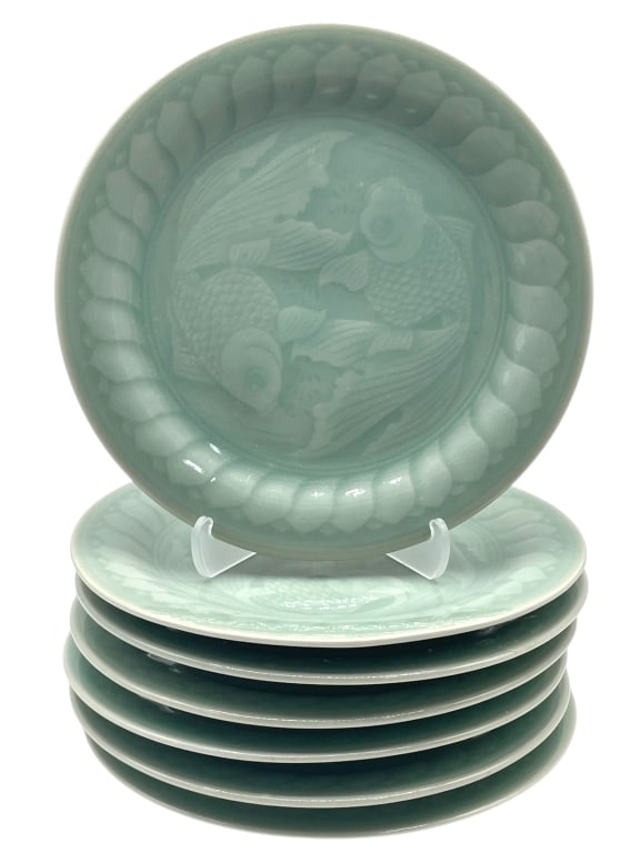 7 CELADON PORCELAIN PLATES WITH KOI FISH DESIGN 7": 7 CELADON PORCELAIN PLATES WITH KOI FISH DESIGN 7" -Very good pre owned condition -Set of 7 plates -Approx 7" dia. -Celadon porcelain plates, each beautifully embossed with a pair of swimming koi fish