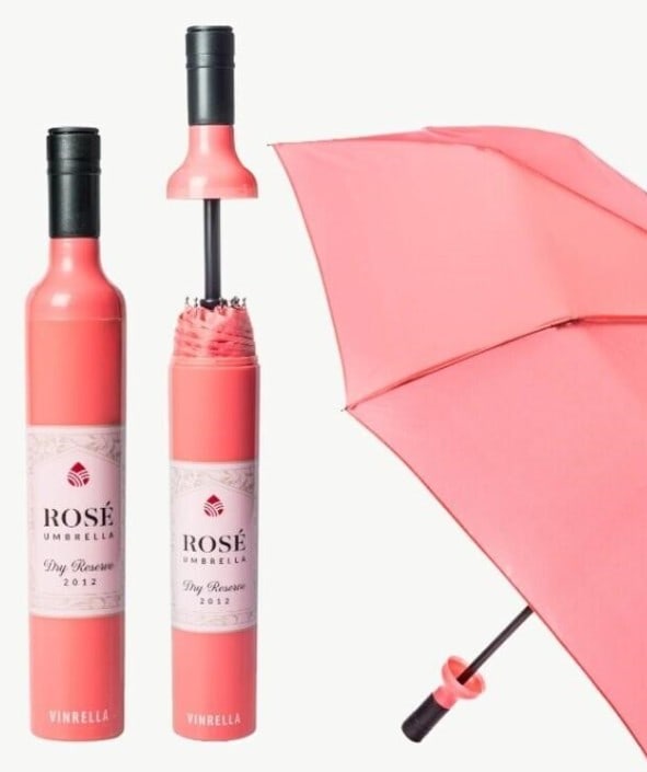 NEW! VINRELLA ROSE LABELED WINE BOTTLE UMBRELLA: NEW! VINRELLA ROSE LABELED WINE BOTTLE UMBRELLA -NEW -1 of 2 -38” DIAMETER UMBRELLA, BOTTLE 12" X 2" -WITH A BURST OF PEACHY PINK, CARRYING THIS TO BRUNCH WILL MAKE EVERYONE THINK “I WANT WHAT