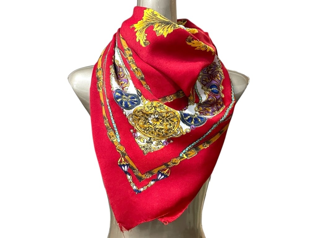 AKBASLAR RED SCARF W JEWEL & BAROQUE MOTIF 45": AKBASLAR RED SILK SCARF W JEWEL & BAROQUE MOTIF 45" -Very good pre owned condition -Approx 45" -Scarf in rich red, adorned with ornate baroque gold scrolls, jeweled accents, and a deep navy center med