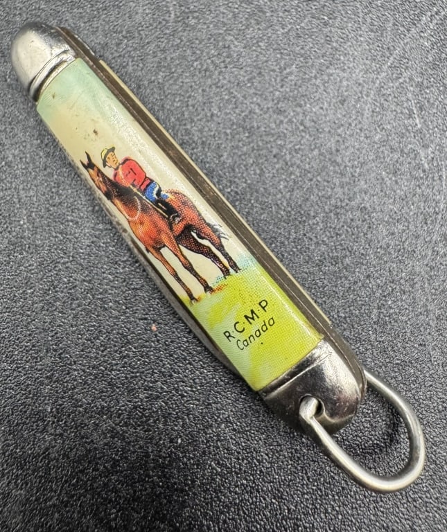 VINTAGE R.C.M.P. CANADA SOUVENIR POCKET KNIFE 2": VINTAGE R.C.M.P. CANADA SOUVENIR POCKET KNIFE 2" -Good pre owned condition -Approx 2"l -Charming vintage souvenir pocket knife featuring a colorful enamel-style handle depicting a Royal Canadian Mount