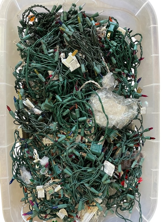 BIN WITH MULTI-COLOR CHRISTMAS LIGHT STRANDS: BIN FILLED WITH MULTI-COLOR CHRISTMAS LIGHT STRANDS -GOOD PRE OWNED CONDITION, UNTESTED -INCLUDES A VARIETY OF LIGHT SETS WITH GREEN WIRING, RED, CLEAR, AND MULTI-COLOR BULBS. PERFECT FOR HOLIDAY DECO