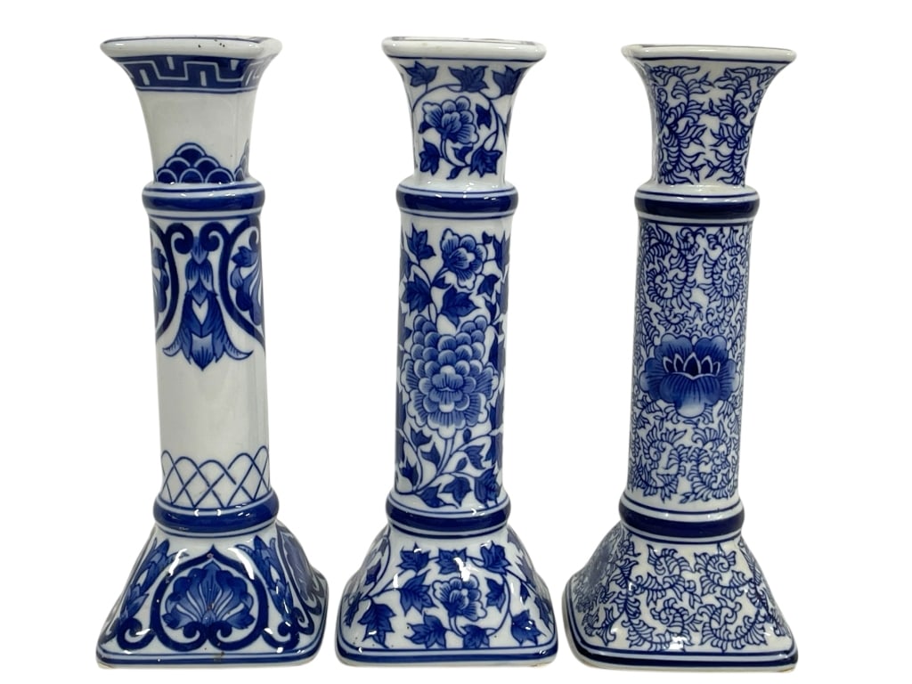 3 BOMBAY BLUE AND WHITE PORCELAIN CANDLESTICKS 10": 3 BOMBAY BLUE AND WHITE PORCELAIN CANDLESTICKS 10" -Very good pre owned condition -Approx 10"h x 4"w -Elegant set of three blue and white porcelain candlesticks, each featuring a unique hand-painted c