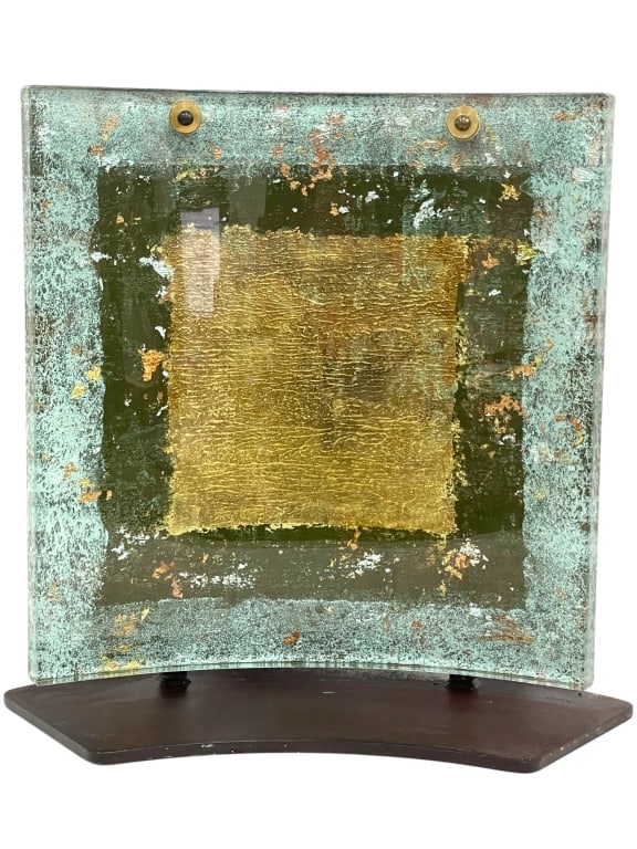 MURANO STYLE ART GLASS PANEL ON STAND 18": MURANO STYLE ART GLASS PANEL WITH GOLD FOIL ON STAND – 18" X 17"A STRIKING CONTEMPORARY ART GLASS PANEL IN THE STYLE OF MURANO, FEATURING A RICHLY TEXTURED DESIGN WITH GOLD FOIL CENTER ACCENT SURROU