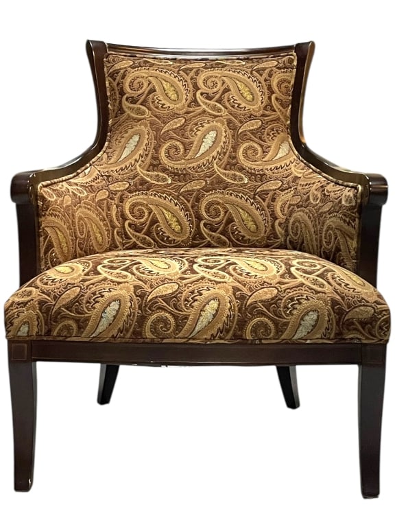 ARHAUS UPHOLSTERED ARMCHAIR WITH WOODEN FRAME 36": ARHAUS UPHOLSTERED ARMCHAIR WITH WOODEN FRAME 36" -VERY GOOD PRE OWNED CONDITION -APPROX 29”W X 28”D X 36”H -FEATURING A BROWN AND GOLD PAISLEY PATTERN FABRIC. STYLISHLY CURVED BACK