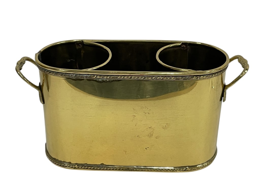 BRASS DOUBLE WINE BOTTLE HOLDER 11": BRASS DOUBLE WINE BOTTLE HOLDER / COOLER WITH SIDE HANDLES -Very good pre owned condition -Approx 11"l x 5"w x 6.5"h -This elegant vintage brass double wine bottle holder features a classic oval form