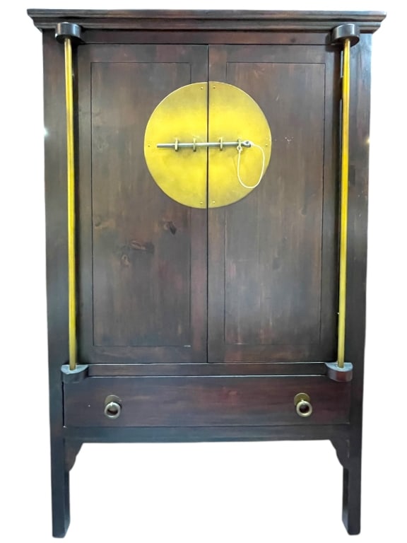 ASIAN-STYLE WOOD AND BRASS ACCENT ARMOIRE 58": ASIAN-STYLE WOOD AND BRASS ACCENT ARMOIRE -This striking Asian-style wood and brass accent armoire features a rich dark wood finish, a large circular brass medallion lock plate at center, and tall ver