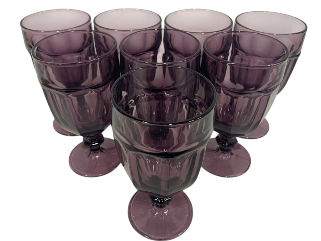 SET OF 8 AMETHYST PURPLE STEM GOBLETS: SET OF 8 AMETHYST PURPLE STEM GOBLETSElegant set of eight amethyst-colored pressed glass goblets with sturdy stems and deep purple tones. These striking glasses add drama and sophistication to any din