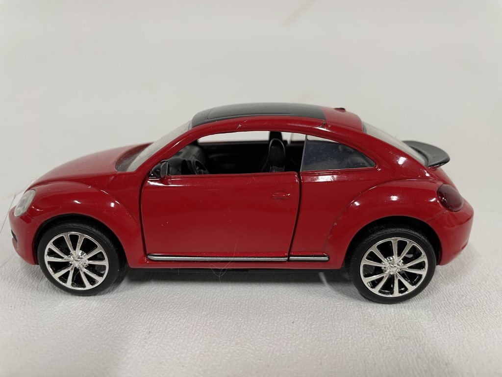 VOLKSWAGEN BEETLE DIECAST MODEL CAR RED SPORT ED: VOLKSWAGEN BEETLE DIECAST MODEL – RED SPORT EDITION -Good pre owned condition -Charming Volkswagen Beetle diecast model finished in glossy red with black roof detailing and chrome trim. -JA 103025 #