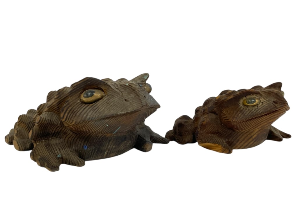 PAIR OF HAND-CARVED WOODEN FROGS 5": PAIR OF HAND-CARVED WOODEN FROGS 5" -Good pre owned condition, smaller from has chipped arm (see photos) -Approx 3" x 5" and 2" x 4" -Charming pair of hand-carved wooden frog sculptures, each intricat