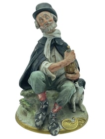 PORCELAIN FIGURINE OF MAN WITH WINE AND DOG 10"