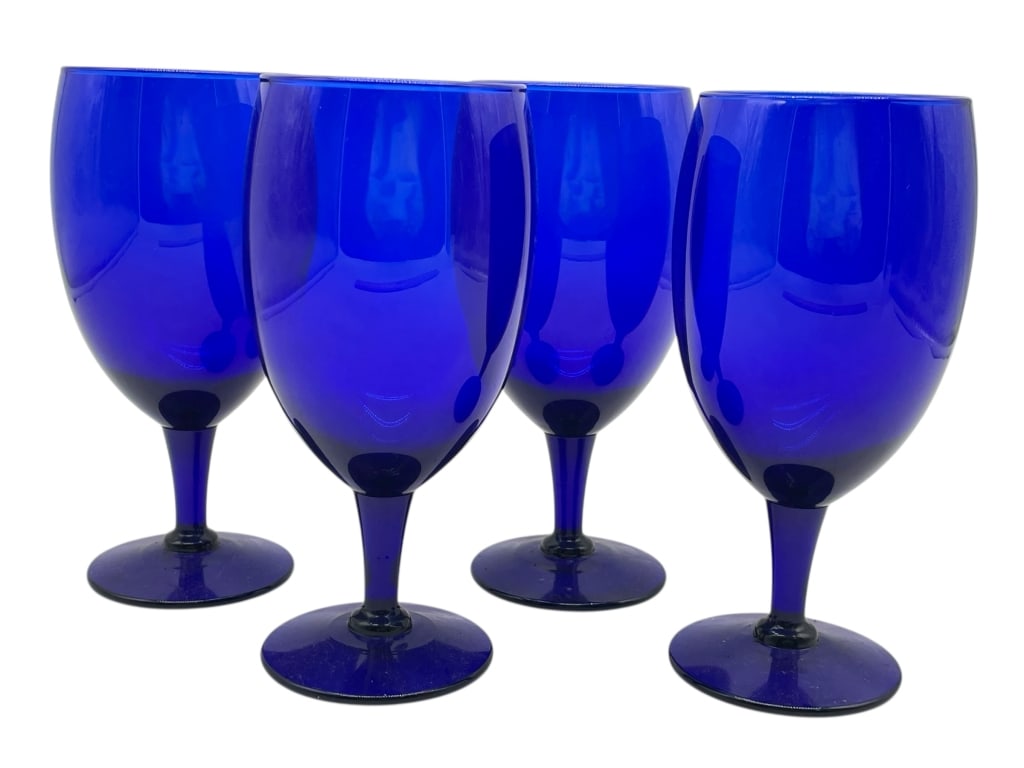 4 COBALT BLUE GLASS STEMMED WATER GOBLETS: 4 COBALT BLUE GLASS STEMMED WATER GOBLETS -VERY GOOD PRE OWNED CONDITION -SET OF 4 GLASSES -APPROX 7" X 2.75" -STRIKING SET OF FOUR MATCHING STEMMED GOBLETS IN VIBRANT COBALT BLUE GLASS. EACH FEATURES