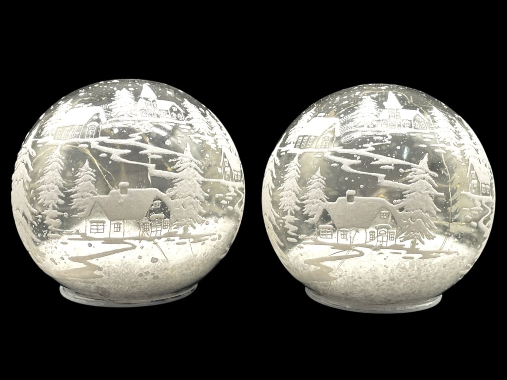 PAIR OF FROSTED GLOBES FEATURING A WINTER VILLAGE: PAIR OF FROSTED GLOBES FEATURING A WINTER VILLAGE SCENE -VERY GOOD PRE OWNED CONDITION, UNTESTED -APPROX 5.5" X 5.5" -PAIR OF FROSTED GLOBES FEATURING A WINTER VILLAGE SCENE WITH SNOW-COVERED COTTAGES