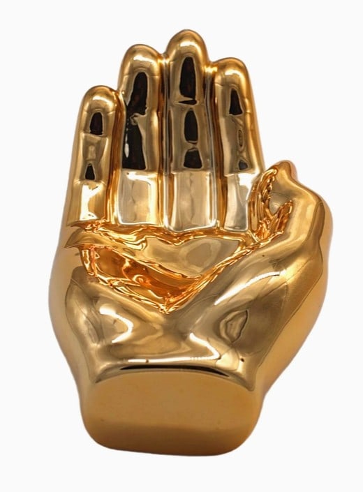 NOVELTY BRONZE HAND TRAY DECORATION 7.5": The Bronze Hand Tray Decoration adds a sophisticated touch to any space with its elegant design and metallic finish. Perfect for holding trinkets or as a decorative statement piece, it effortlessly bl