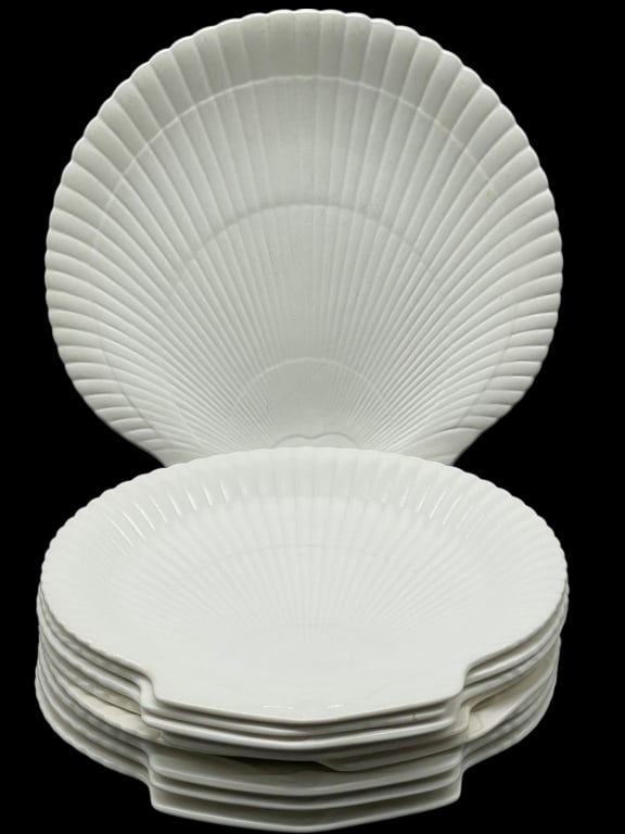 8 WEDGWOOD WHITE SHELL-FORM PLATES 9" ONE SERVING: WEDGWOOD WHITE SHELL-FORM PLATES, SET OF 9 (9") PLATES INCLUDING ONE LARGE SERVING PLATE (10") -This elegant matching collection features eight 9" shell-shaped dinner plates and one larger 10" serving