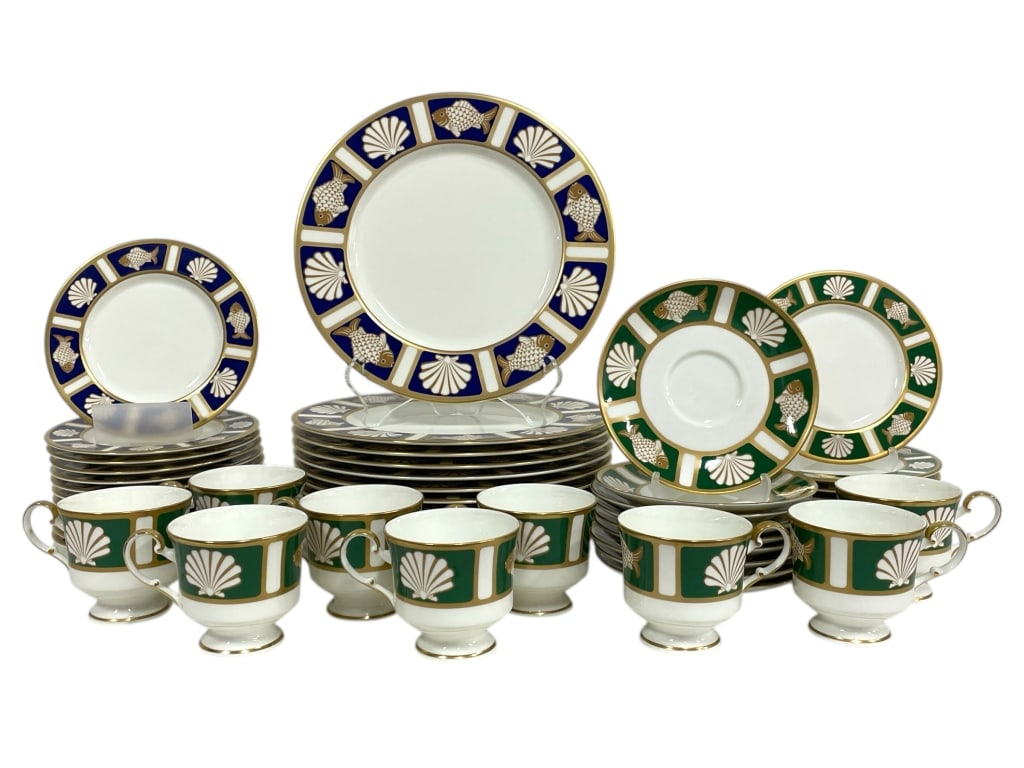 MIKASA BONE CHINA DINNERWARE "FISH & SHELL" 51 PCS: MIKASA BONE CHINA DINNERWARE "FISH & SHELL" PATTERN IN BLUE & GREEN -Very good pre owned condition -Set includes: 9 teacups in green 9 saucers 6" in green 9 plates 6.5" in green 12 plates 6.5" in blue