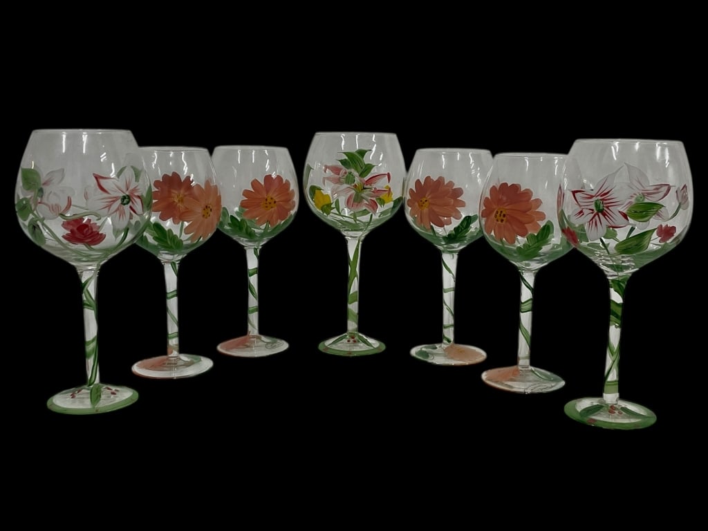 SET OF 7 HAND PAINTED FLORAL WINE GOBLETS: SET OF 7 HAND PAINTED FLORAL WINE GOBLETS -Beautiful set of seven hand painted wine goblets featuring vibrant florals in shades of coral, white, yellow, and green, each with unique brushwork and decor