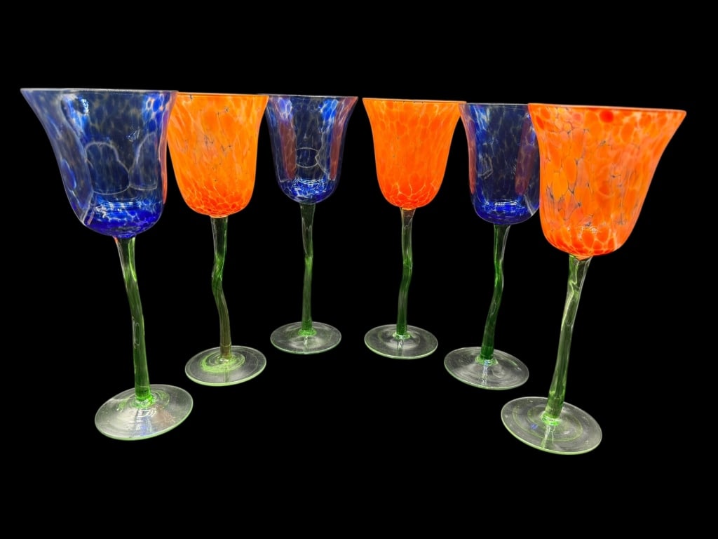 SET OF SIX HAND-BLOWN ART GLASS STEMMED GOBLETS: SET OF SIX HAND-BLOWN ART GLASS STEMMED GOBLETS -A vibrant and whimsical set of six hand-blown art glass goblets featuring striking red and clear mottled bowls paired with organic, twisted green stems