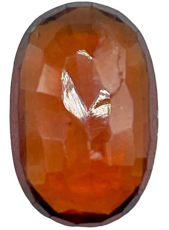 5.280 CT NAURAL HESSONITE GARNET GEMSTONE: 5.280 CT NAURAL HESSONITE GARNET GEMSTONE -SU10 -OVAL CUT 13.59 X 9.10 X 3.90MM -BROWN -NATURAL INCLUSIONS -JA 123024 ***Please note that due to limited storage space, all items must be picked up with