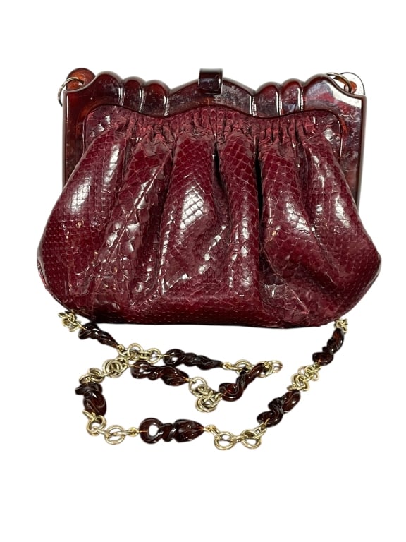 VINTAGE WINE SNAKESKIN COLOMBETTI MILANO ITALY BAG: - genuine snakeskin in the prettiest color maroon wine - tortoiseshell colored lucite top frame - gold chain with tortoise loops throughout - it is so pretty - very good condition By bidding on this l