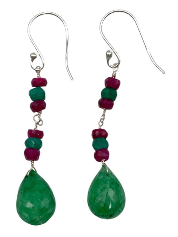 RUBY & EMERALD DANGLE EARRINGS: RUBY & EMERALD DANGLE EARRINGS -Very good pre owned condition -Approx 2" long -Each earring is finished with a polished emerald teardrop that adds gorgeous movement and color. The rich contrast of dee