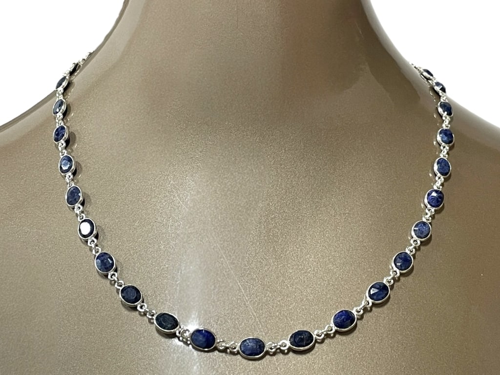 FACETED BLUE SAPPHIRE OVAL-LINK NECKLACE: FACETED BLUE SAPPHIRE OVAL-LINK NECKLACE -Very good pre owned condition -The deep midnight-to-cobalt hues highlight the natural beauty of the sapphires, making this a timeless piece perfect for both e