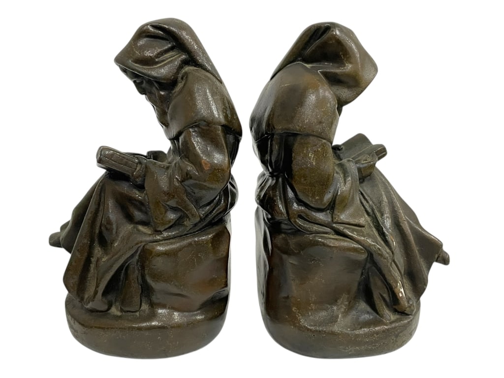 PAIR OF BRONZED SEATED MONKS BOOKENDS 7": PAIR OF BRONZED SEATED MONKS BOOKENDS 7" -Good pre owned condition, one has some chips (see photos) -Approx 7"h x 4"w -A beautifully crafted pair of monk bookends, each depicting a hooded robed figure